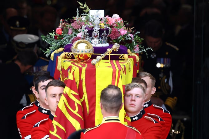 The coffin is carried out following the State Funeral of Queen Elizabeth II, held at Westminster Abbey, London. Picture date: Monday September 19, 2022.