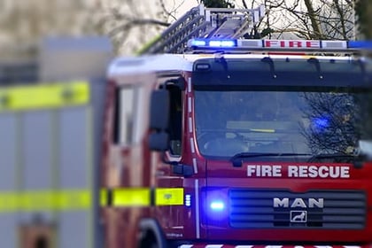 Car fire spreads to house