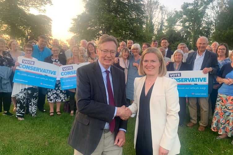 Sir Gary Streeter shakes hands with Rebecca Smith