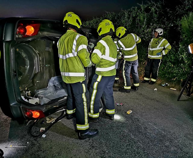 Driver ‘in good spirits’ after car ends up on its side in crash