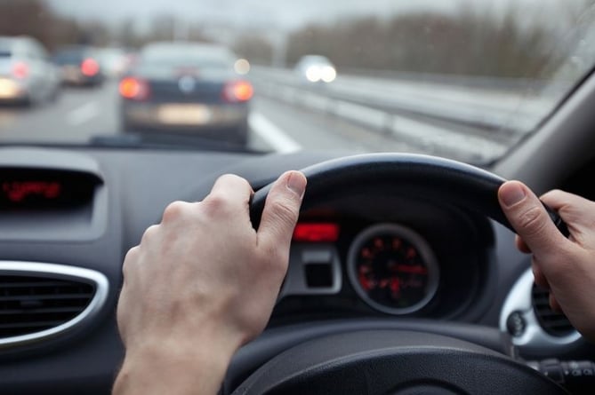 Driver behind wheel