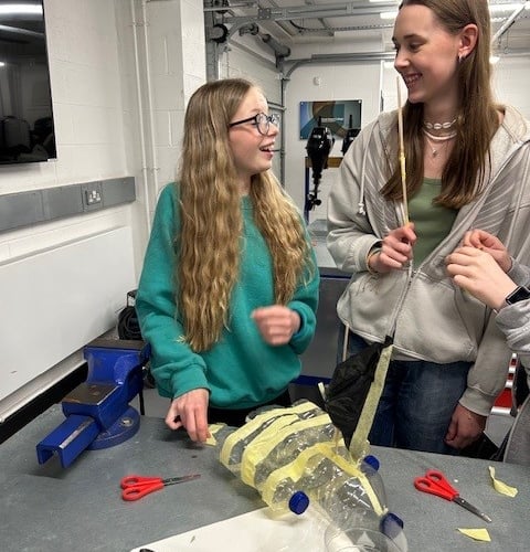 Two students at Dartmouth Academy learn about marine engineering