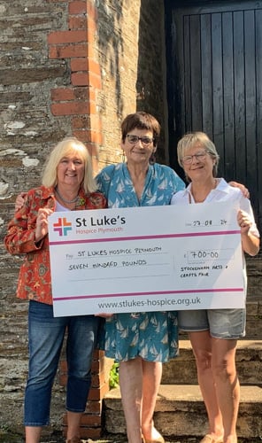 Committee members:Carol Gameson- Hughes, Jan Clarke and Jo Wells handing
 over the £700 cheque to St Luke’s Hospice.
