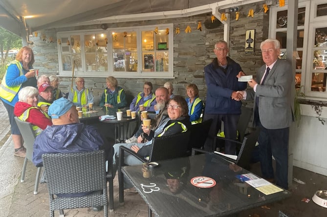 Some of the hardy group of volunteers having a coffee break and sheltering from the rain