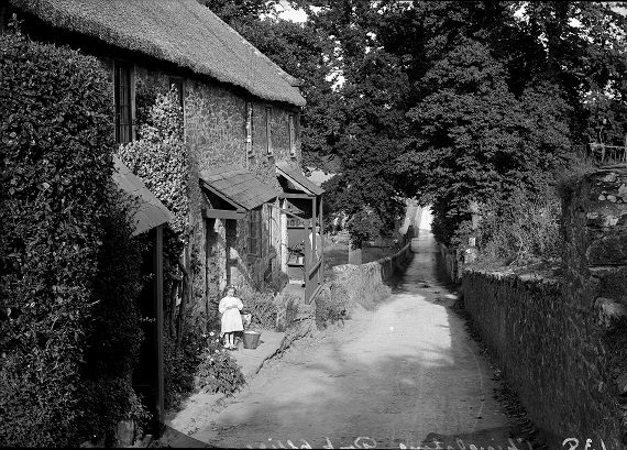 Chivelstone Post Office'. Small girl on front step