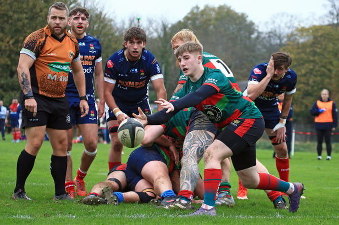 Dartmouth's number nine passes out from a ruck