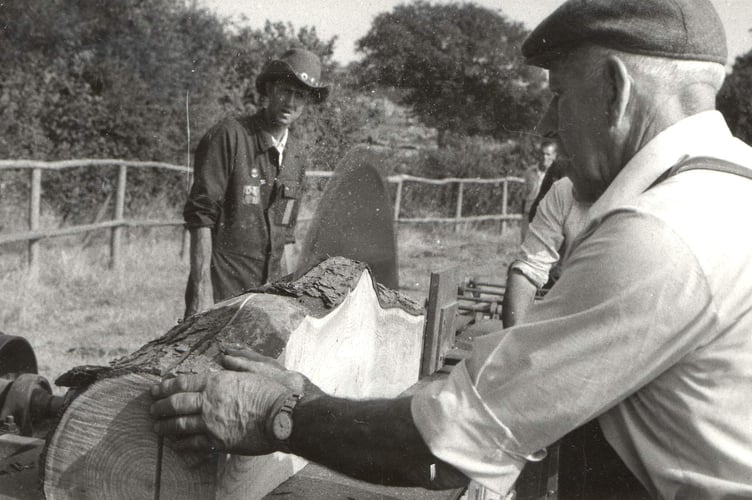 Peter Bovey, on left, and Wally? operating a rack saw.