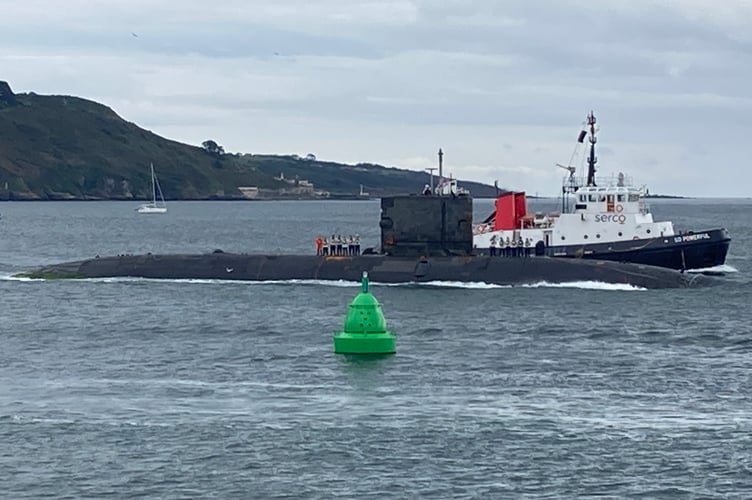 A submarine and tug in Plymouth Sound