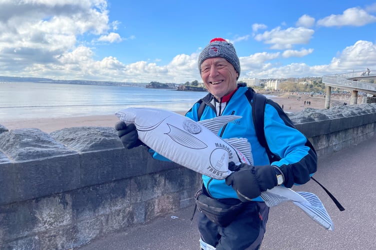 Ian Nuttal, 77, of Kingswear took part in the walk with his inflatable Grimsby Town Football Club mascot – Harry the Haddock