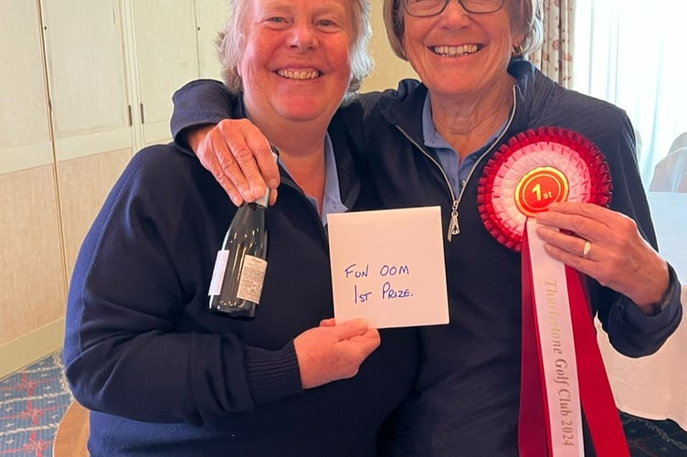 Pam Adams presents Jan Brooking with her Order of Merit first prize at the ladies AGM