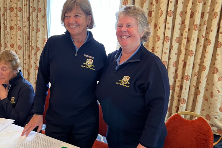 Thurlestone’s present lady captain Pam Adams  (right ) hands over at the AGM  to Fiona Turner, who is  Lady Captain for 2025